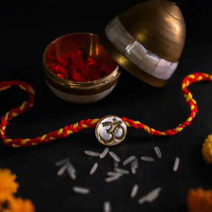 Om Akshara golden Rakhi & Pendant